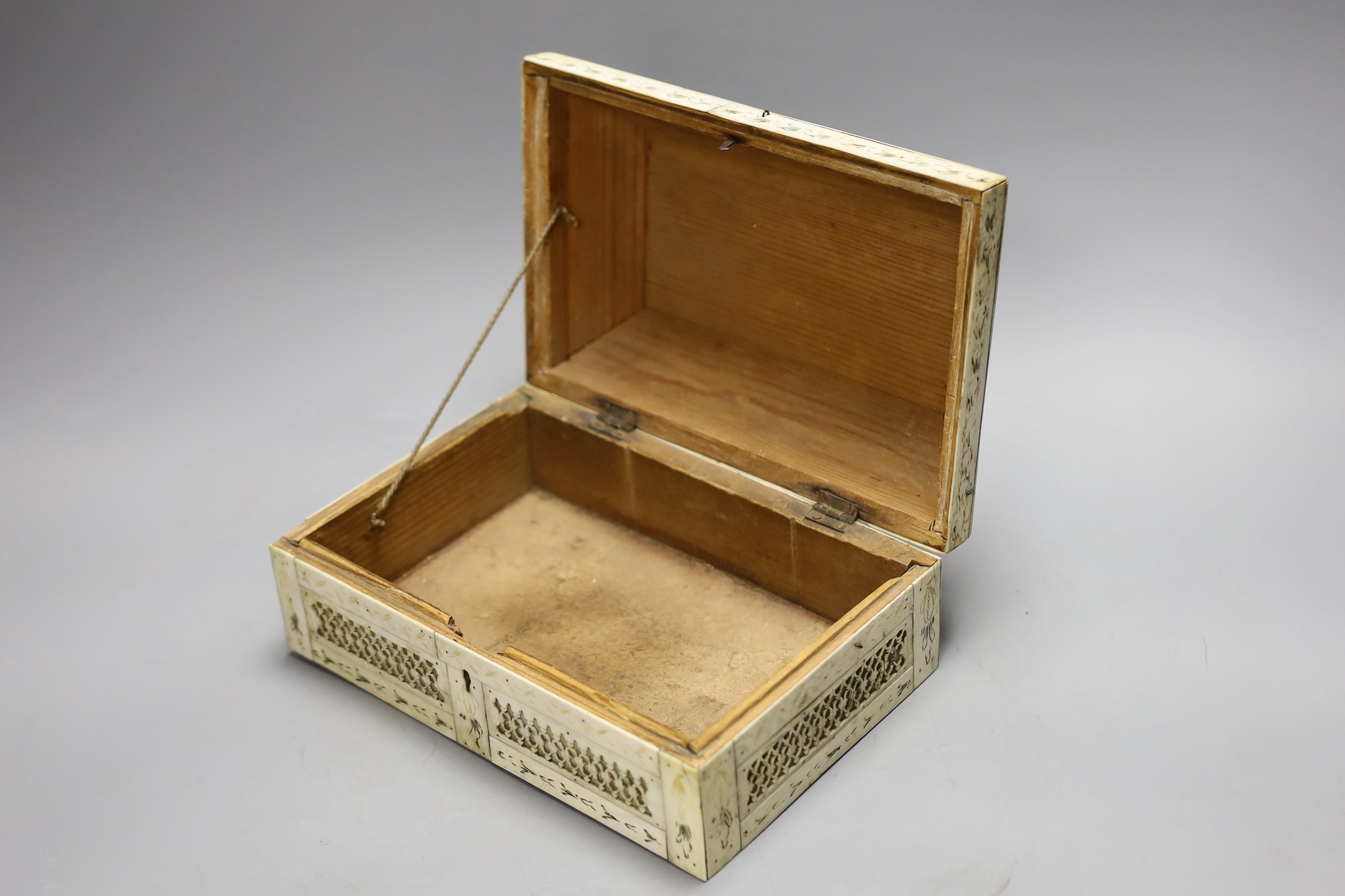 A 19th century prisoner of war fretted bone box, 21.5cm wide